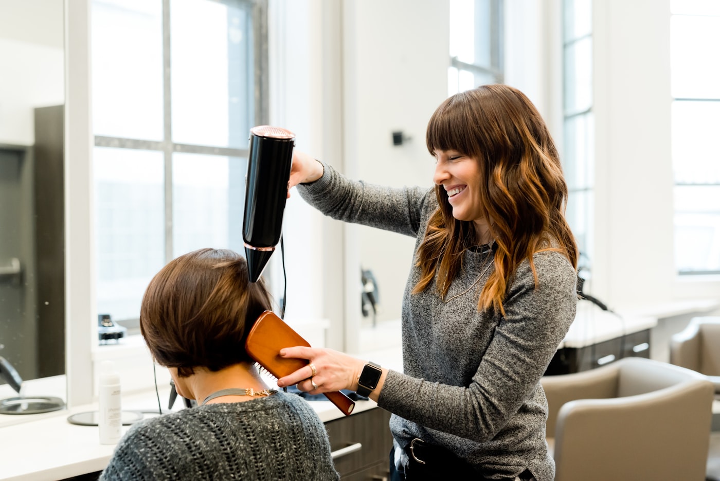 A stylist with a client mid-appointment